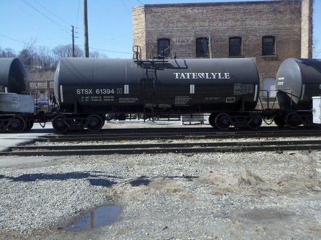We watched tank car after tank car of corn syrup roll by.