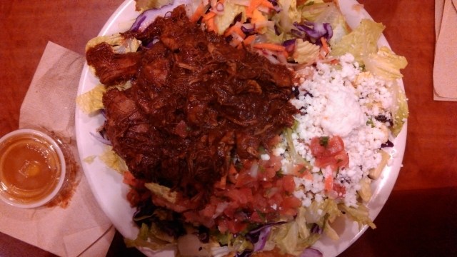 Tostada with chicken that had been marinated in grilled pineapple.