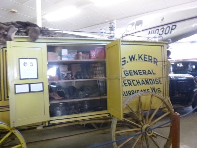 Peddler's wagon. My mom said she could remember a man coming by with a wagon like this.